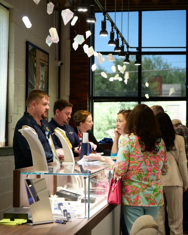 Bert Esterhuysen serving clients at the Living in Color trunk show